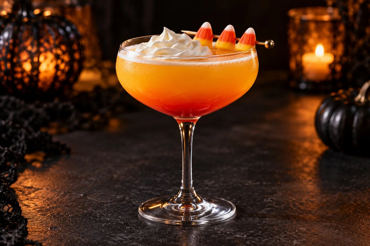 Orange Candy Corn Martini with a grenadine gradient, whipped cream and three candy corn pieces