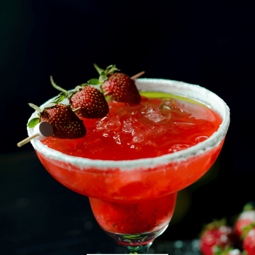 Homemade Cayman Jack Strawberry Margarita garnished with strawberries