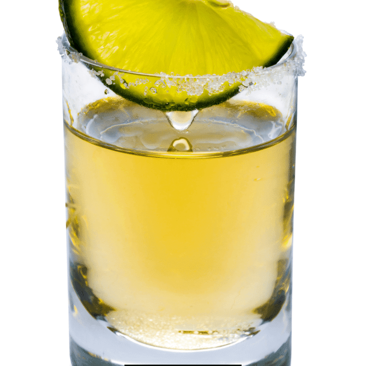 Jolly Rancher Tequila Cocktail topped with lemon slice