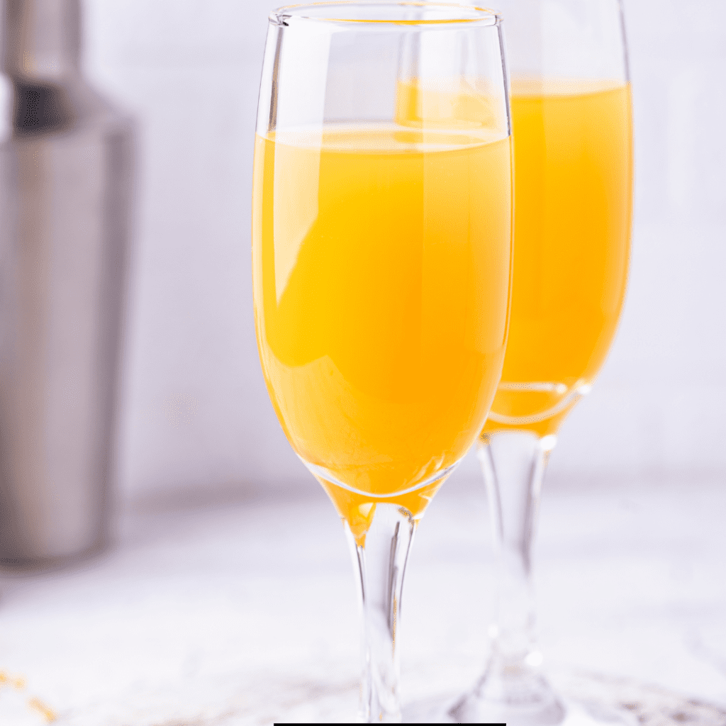 Two glasses of Prosecco and Orange Juice for fruity delight